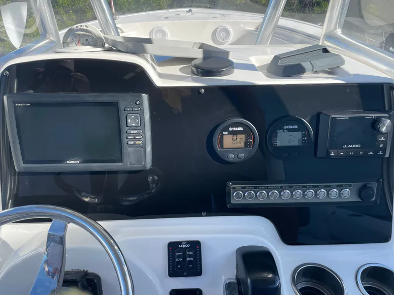 Slide: The Image of Dashboard of a 2017 Tidewater 220 boat with Garmin and Yamaha instruments. - 33