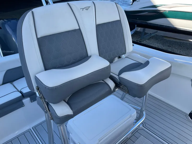 Slide: The Image of Seat on a 2017 Tidewater 220 boat, gray and white upholstery. - 39