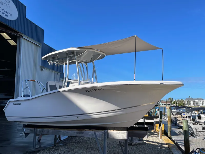 Slide: The Image of 2017 Tidewater 220 boat at marina, blue sky. - 4