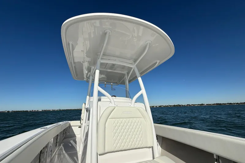 Slide: The Image of 2026 Jupiter 26 boat on open water under clear blue sky. - 14