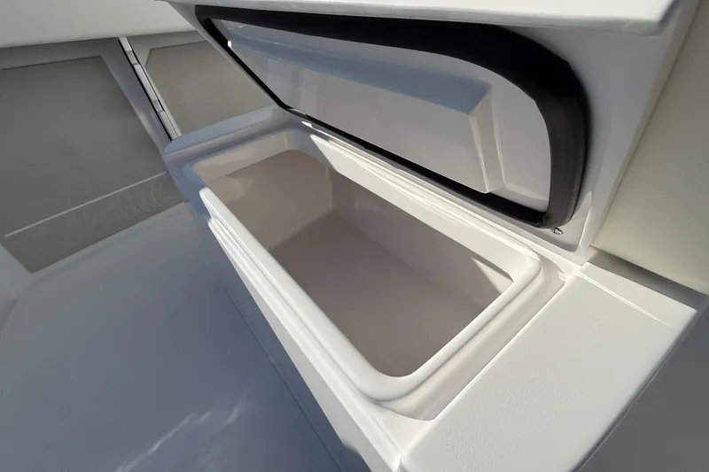 Slide: The Image of Open storage compartment on 2026 Jupiter 26 boat, showcasing spacious interior design. - 26