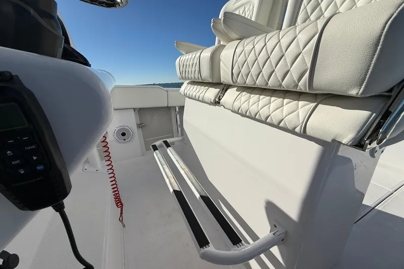 Slide: The Image of Interior of 2026 Jupiter 26 boat with quilted seating and marine equipment. - 27