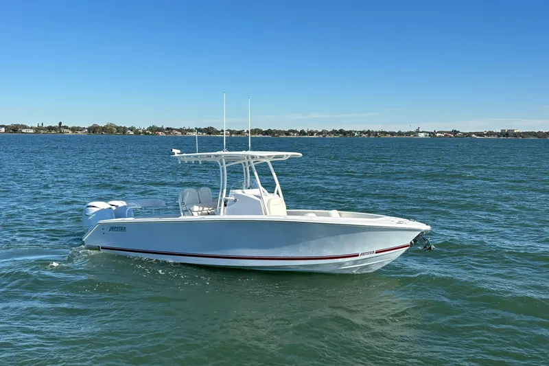 The Image of 2026 Jupiter 26 boat cruising on a calm sea under a clear blue sky. - 6