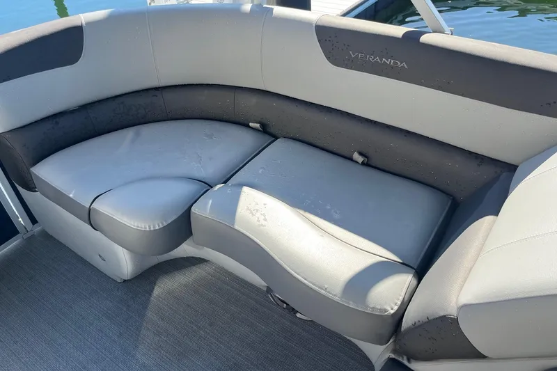 Slide: The Image of 2023 Veranda Relax VR22RC boat seating with gray upholstery, wet from water exposure. - 5