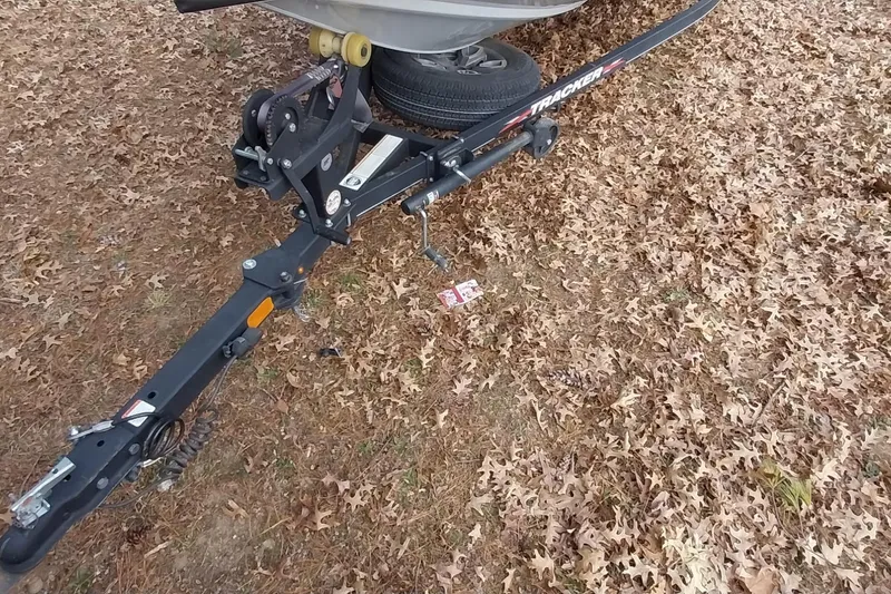 Slide: The Image of Trailer hitch of 2022 Tracker Pro Team 195 TXW on autumn leaves. - 13