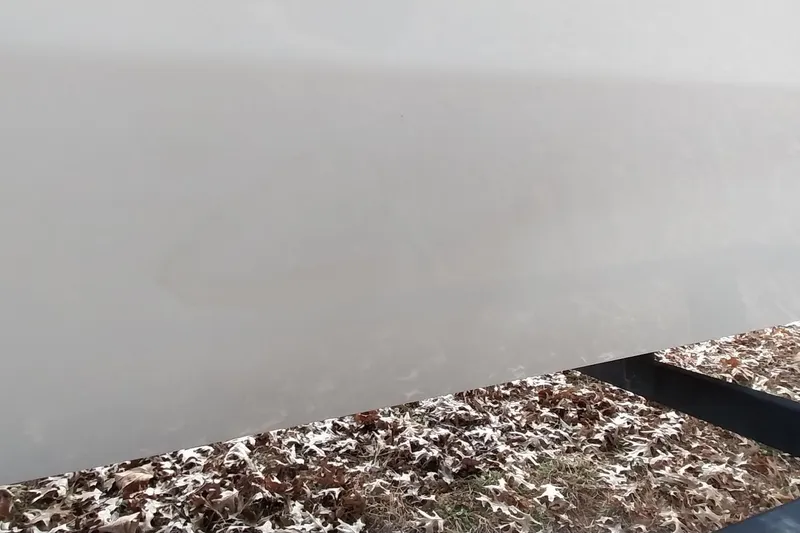 Slide: The Image of 2022 Tracker Pro Team 195 TXW boat hull with autumn leaves background. - 16