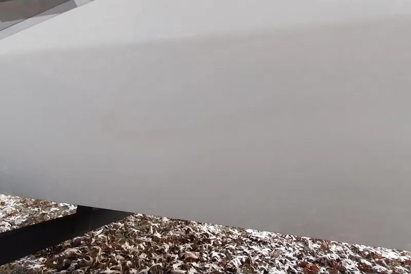 Slide: The Image of 2022 Tracker Pro Team 195 TXW boat hull on snowy ground. - 17