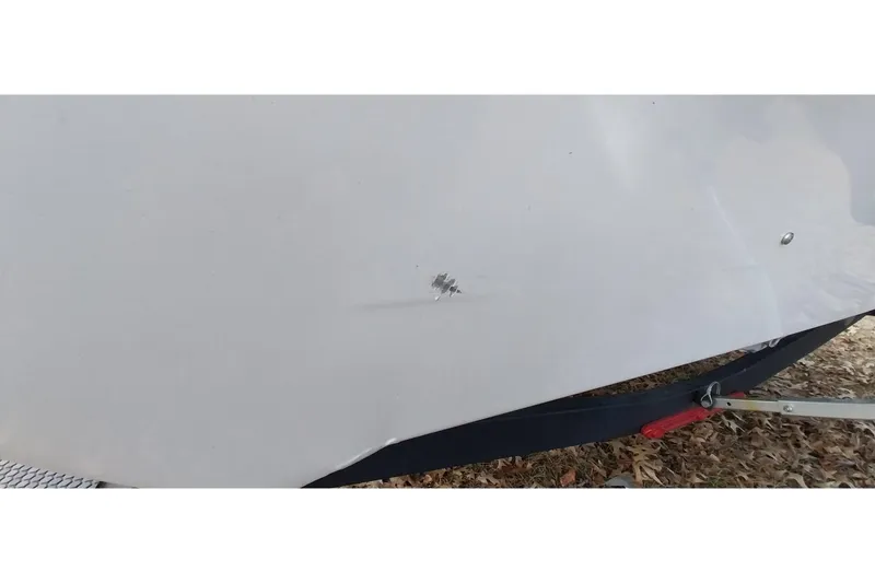 Slide: The Image of 2022 Tracker Pro Team 195 TXW boat with minor hull damage. - 19