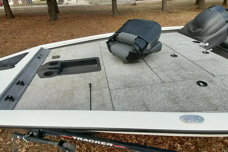 Slide: The Image of 2022 Tracker Pro Team 195 TXW boat deck with seating and storage compartments. - 2