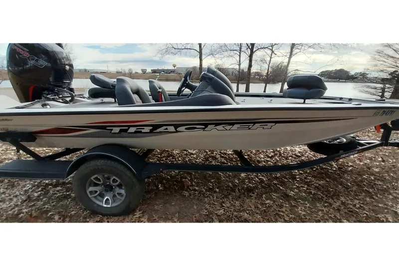 Slide: The Image of 2022 Tracker Pro Team 195 TXW boat on trailer by a lake. - 26