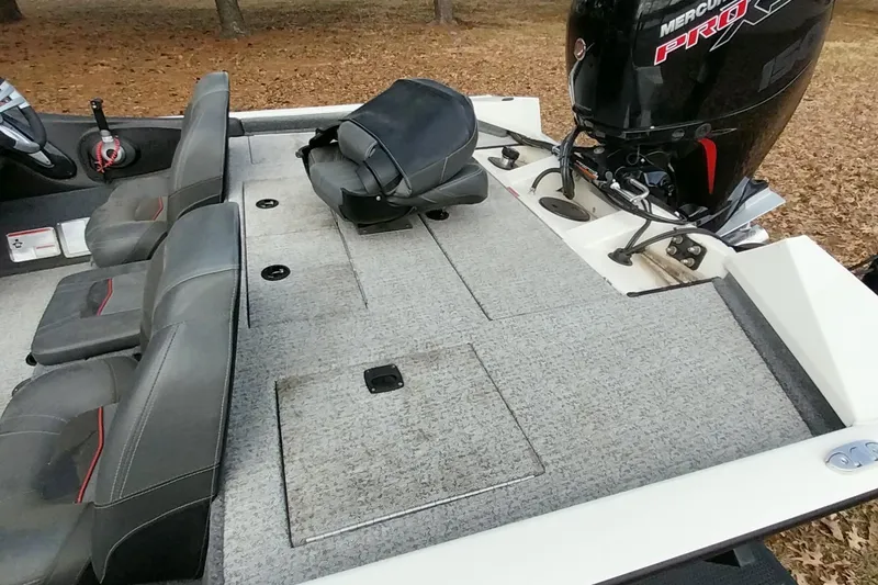 Slide: The Image of 2022 Tracker Pro Team 195 TXW boat interior with seating and Mercury Pro engine. - 33