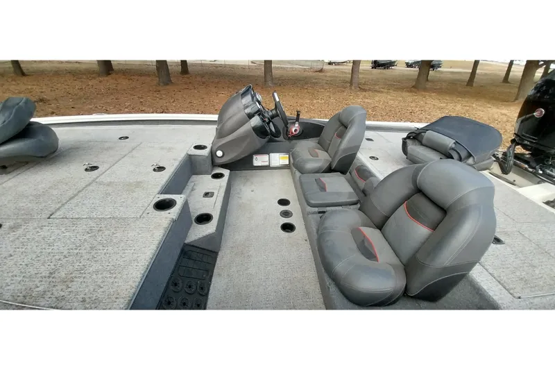 Slide: The Image of 2022 Tracker Pro Team 195 TXW boat interior with gray seating and steering console. - 34