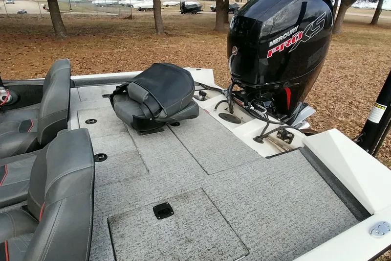 Slide: The Image of 2022 Tracker Pro Team 195 TXW boat with Mercury Pro XS engine, gray seating, and carpeted deck. - 4