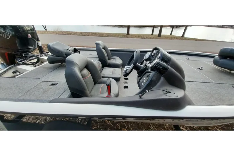 Slide: The Image of 2022 Tracker Pro Team 195 TXW boat interior with seating and steering console. - 6