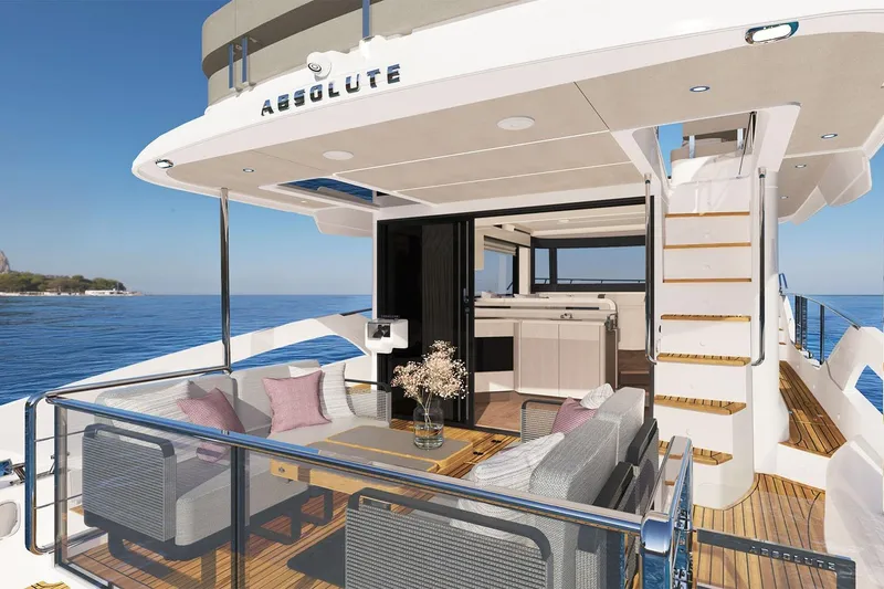 Slide: The Image of Luxurious 2028 Absolute 50 Navetta yacht with elegant outdoor seating and ocean view. - 2