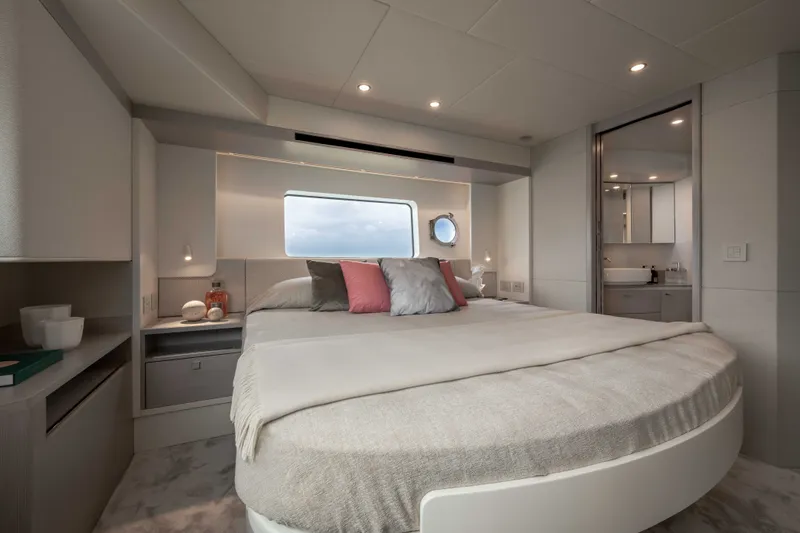 Slide: The Image of Luxurious cabin with a large bed, soft pillows, and modern bathroom on the Absolute 50 Navetta 2027. - 32
