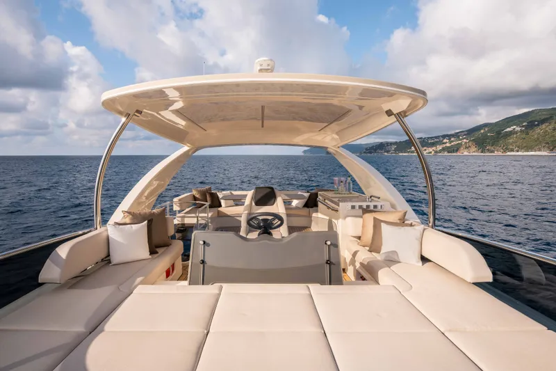Slide: The Image of The 2027 Absolute 50 Navetta features an elegant deck with luxurious seating and panoramic views. - 17
