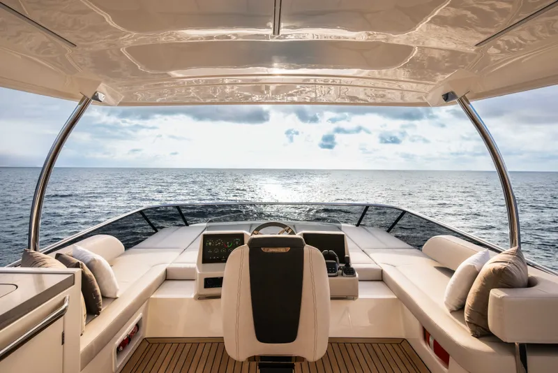 Slide: The Image of The cockpit of the 2027 Absolute 50 Navetta offers a wide view of the sea. - 15