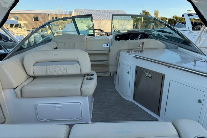 Slide: The Image of Interior of a 2019 Regal 33 OBX boat with seating and kitchenette. - 10