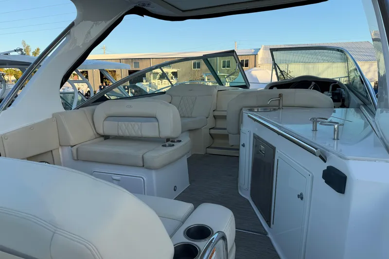 Slide: The Image of 2019 Regal 33 OBX boat interior with luxurious seating and modern amenities. - 11