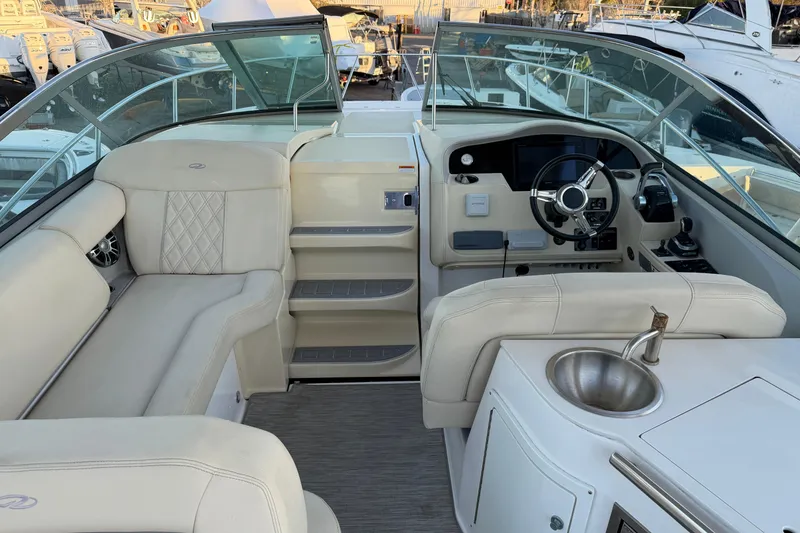 Slide: The Image of 2019 Regal 33 OBX boat interior with luxurious seating and modern helm. - 12