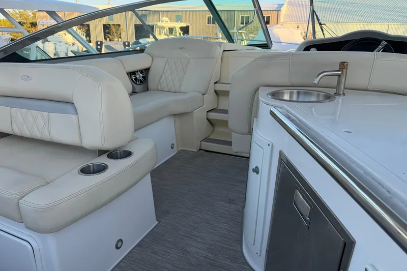 Slide: The Image of Luxurious interior of 2019 Regal 33 OBX boat with seating and kitchenette. - 21