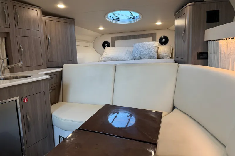 Slide: The Image of Luxurious interior of 2019 Regal 33 OBX boat with modern furnishings and cozy seating. - 23