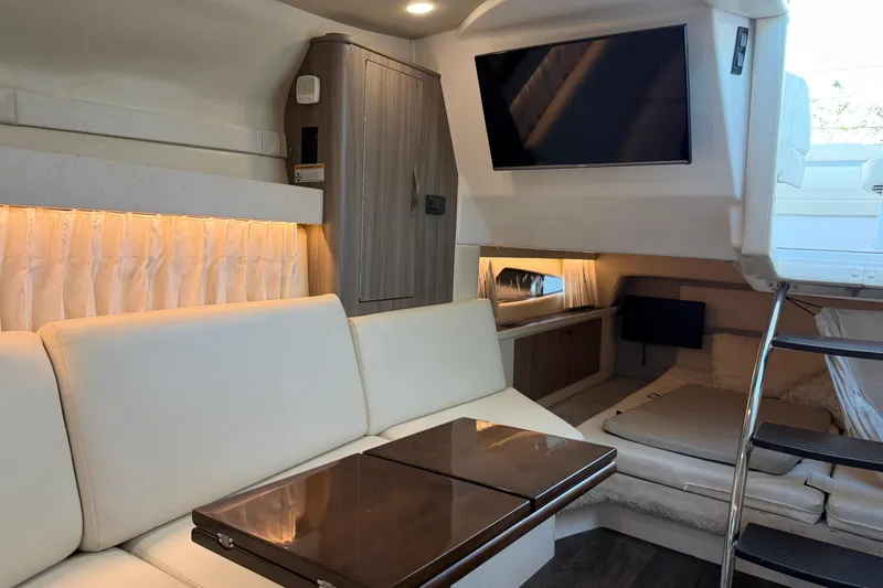 Slide: The Image of Luxurious interior of 2019 Regal 33 OBX boat with modern seating and entertainment system. - 28