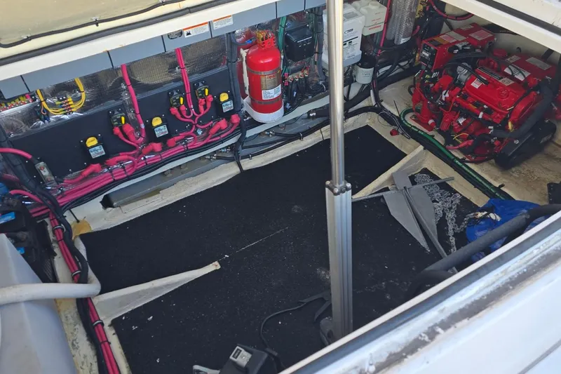 Slide: The Image of Engine compartment of a 2019 Regal 33 OBX boat with wiring and equipment. - 43