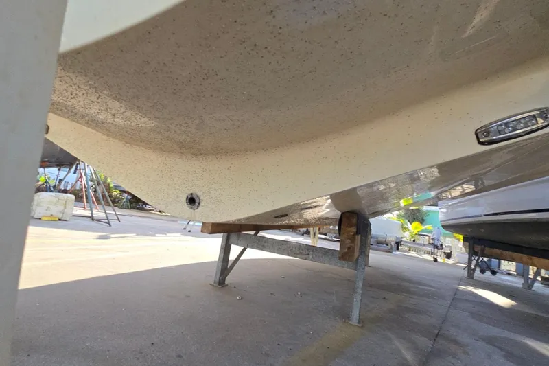 Slide: The Image of 2019 Regal 33 OBX boat hull on a stand, viewed from below. - 6