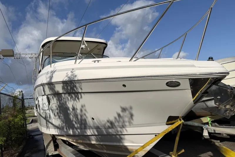 Slide: The Image of 2019 Regal 33 OBX boat on trailer under blue sky. - 9