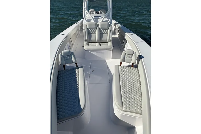 Slide: The Image of 2026 Jupiter 32 boat interior with luxurious seating on calm water. - 20