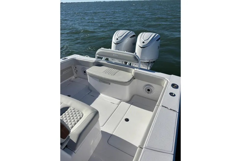 Slide: The Image of 2026 Jupiter 32 boat with dual Yamaha engines on open water. - 22