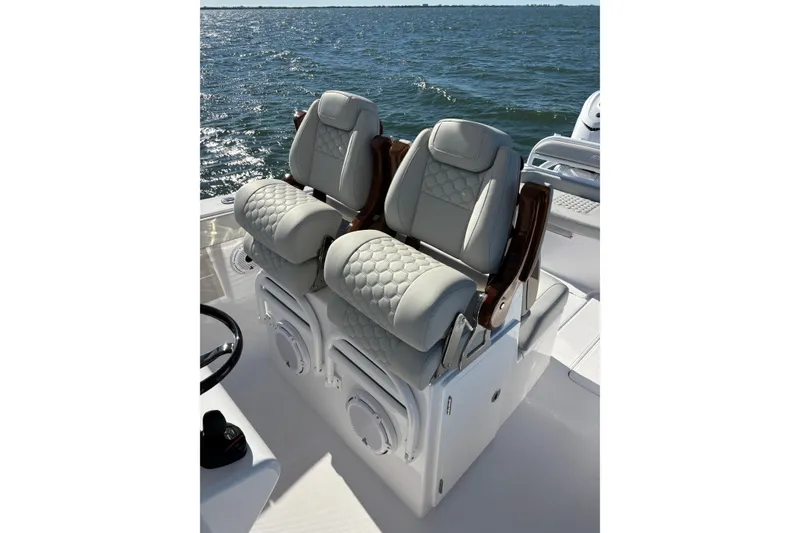 Slide: The Image of Luxurious seating on 2026 Jupiter 32 boat with ocean backdrop. - 27