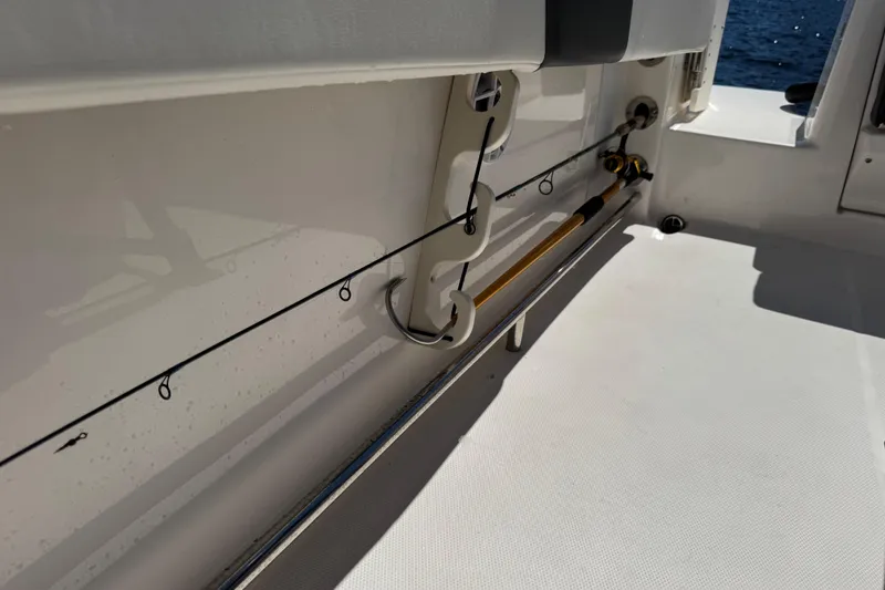 Slide: The Image of 2022 Robalo R242 Center Console fishing rod holder detail on deck. - 24