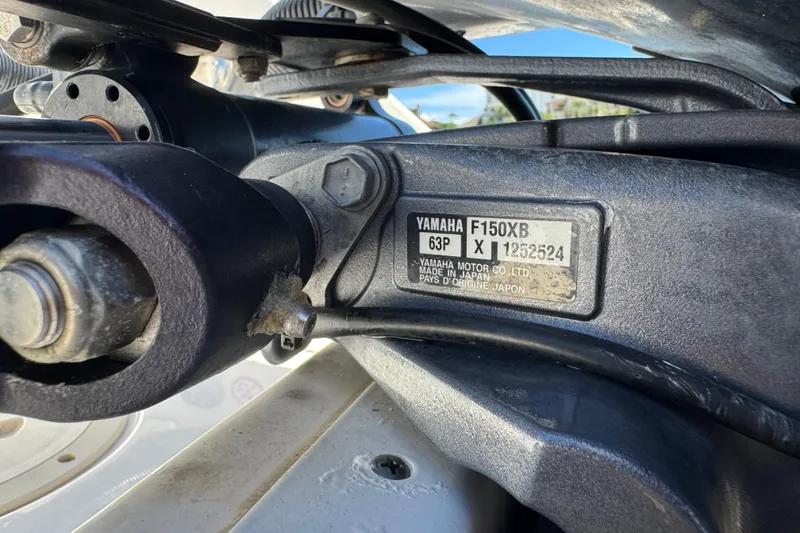 Slide: The Image of Close-up of Yamaha F150XB engine part on 2022 Robalo R242 Center Console boat. - 29