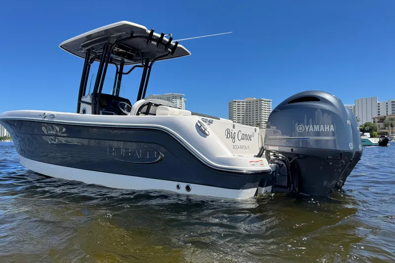 Slide: The Image of 2022 Robalo R242 Center Console boat with Yamaha engine on water. - 3