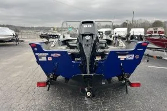 Slide: The Image of 2018 Tracker Pro Guide V-16 WT boat, rear view, parked on a trailer. - 10