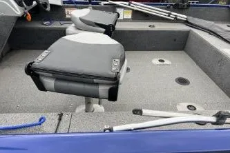 Slide: The Image of 2018 Tracker Pro Guide V-16 WT boat interior with seating and fishing rod holders. - 9