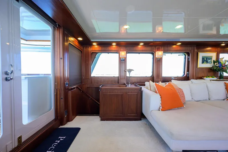 Slide: The Image of Luxurious interior of 1986 Jongert 85 yacht with elegant wood paneling and plush seating. - 11