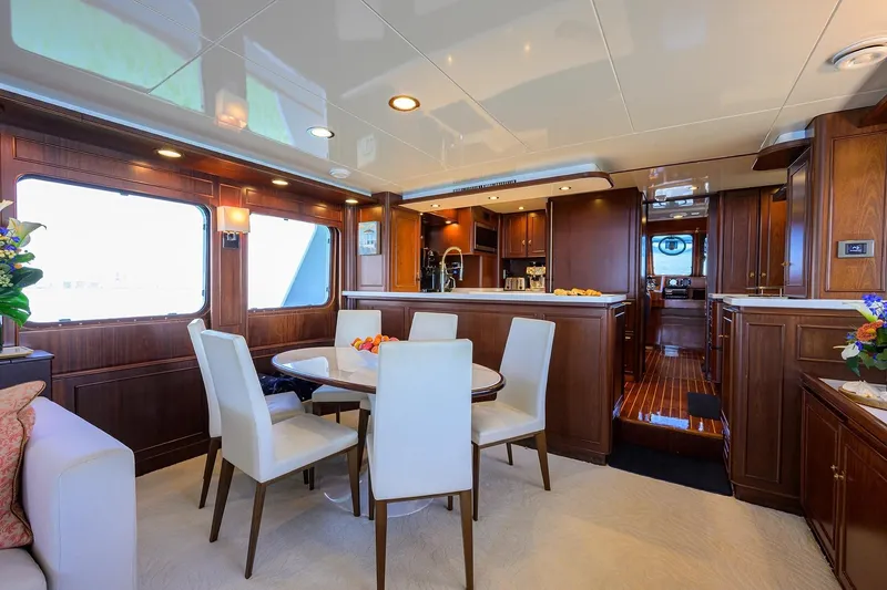Slide: The Image of Luxurious interior of 1986 Jongert 85 yacht with elegant dining area and wooden cabinetry. - 12