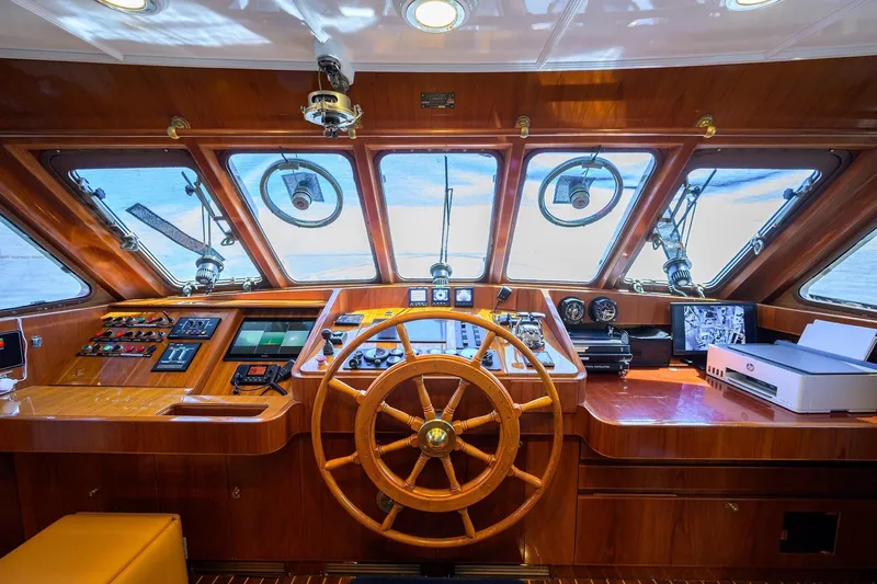 Slide: The Image of Helm of 1986 Jongert 85 yacht with wooden steering wheel and navigation instruments. - 18