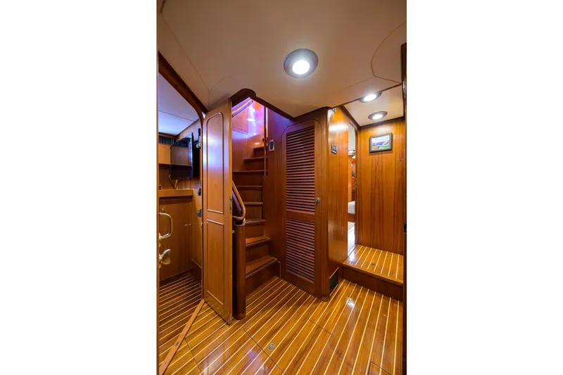 Slide: The Image of Luxurious wooden interior of 1986 Jongert 85 yacht with elegant lighting and polished flooring. - 19