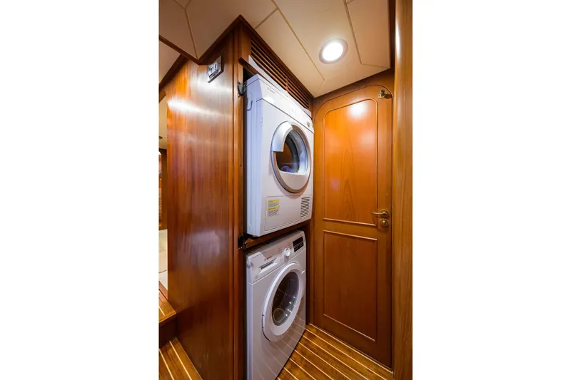 Slide: The Image of Laundry area in 1986 Jongert 85 yacht with stacked washer and dryer. - 21