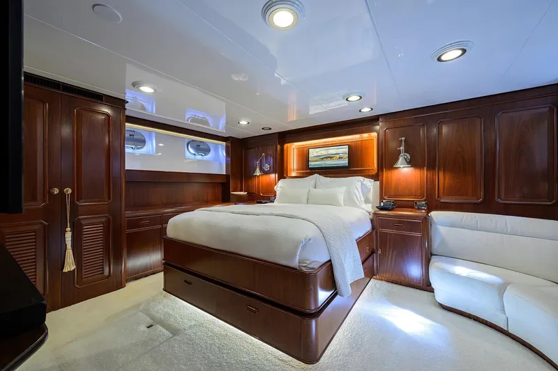 Slide: The Image of Luxurious cabin interior of 1986 Jongert 85 yacht with elegant wood paneling and plush bedding. - 22