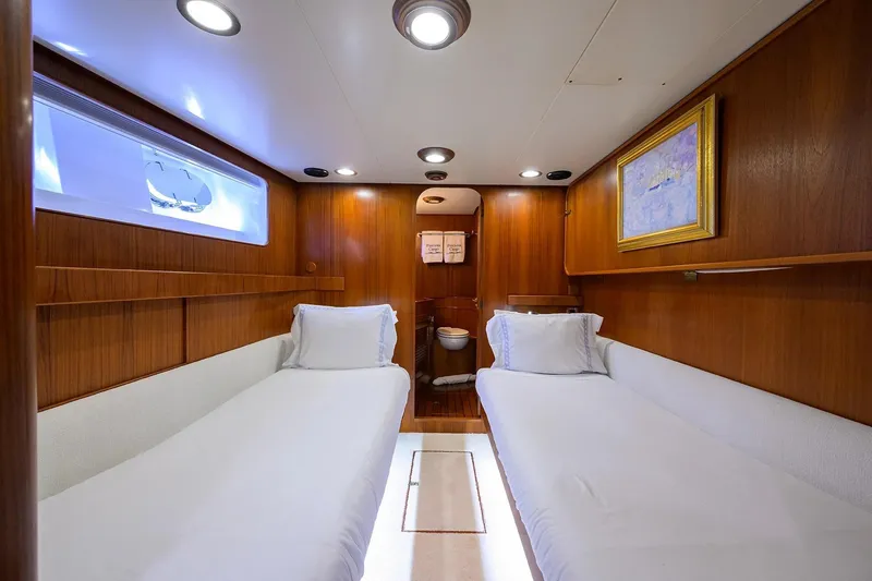 Slide: The Image of Luxurious 1986 Jongert 85 yacht cabin with twin beds and elegant wood paneling. - 27