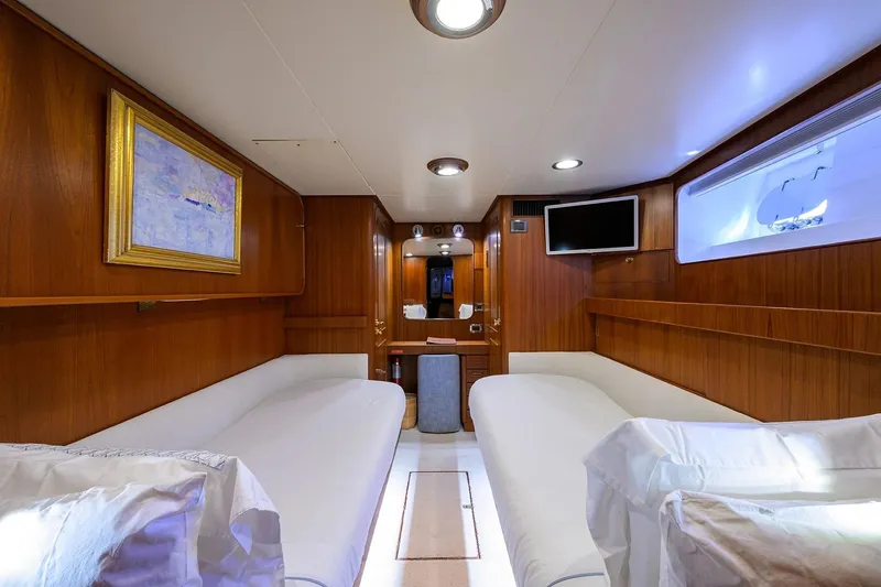 Slide: The Image of Luxurious cabin interior of 1986 Jongert 85 yacht with twin beds and wooden paneling. - 28