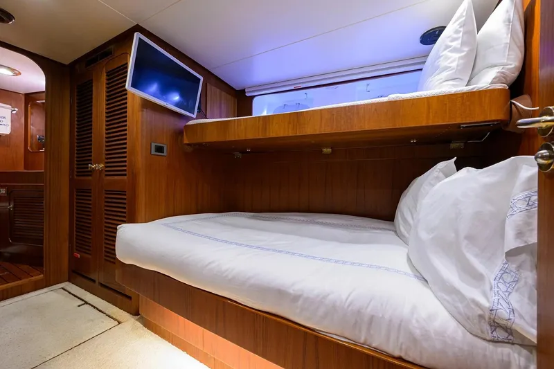 Slide: The Image of Luxurious cabin interior of 1986 Jongert 85 yacht with wooden bunk beds. - 30