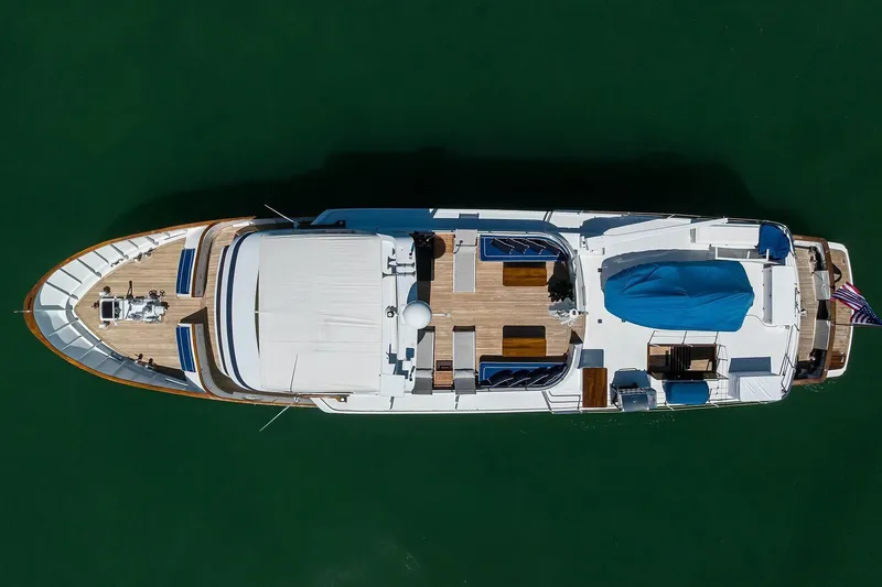 Slide: The Image of Overhead view of 1986 Jongert 85 yacht on calm green water. - 44