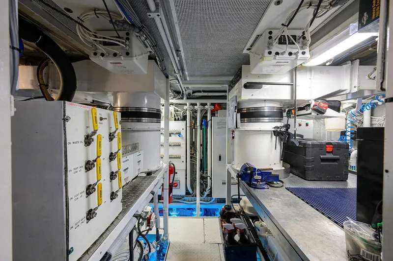 Slide: The Image of Engine room of a 1986 Jongert 85 yacht, showcasing machinery and equipment. - 48